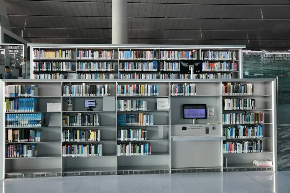Rows of bookshelves filled with books in a modern library, illustrating academic e-journals