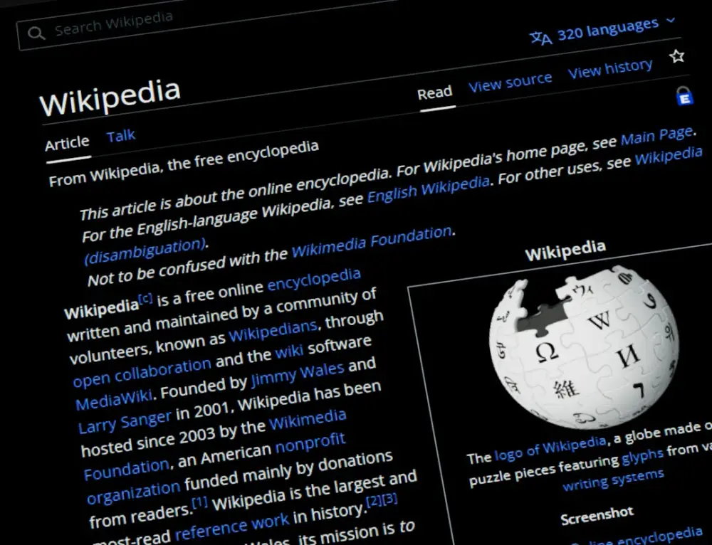 Wikipedia website displayed on a dark screen, illustrating wikipedia consensus and dispute resolution